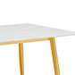 Table de salle à manger minimaliste avec piètement en acier inoxydable doré mat et plateau en pierre frittée
