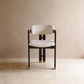 AIKO cream fleece dining chair with black wooden frame and gold foot caps – front studio view