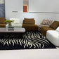 MIRA contemporary modular lounge sofa in brown, ivory and zebra-pattern upholstery.