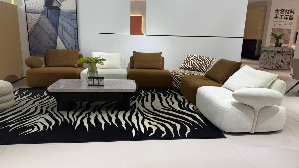 MIRA contemporary modular lounge sofa in brown, ivory and zebra-pattern upholstery.