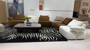 MIRA contemporary modular lounge sofa in brown, ivory and zebra-pattern upholstery.