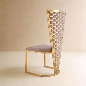Rear three-quarter view of Honeycomb high-back chair with gold hexagonal lattice and mauve velvet panel