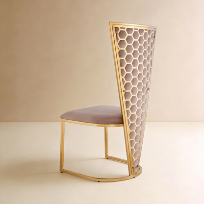 Rear three-quarter view of Honeycomb high-back chair with gold hexagonal lattice and mauve velvet panel