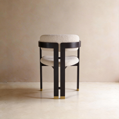 AIKO cream fleece dining chair with curved black wooden back frame and gold foot caps – rear view