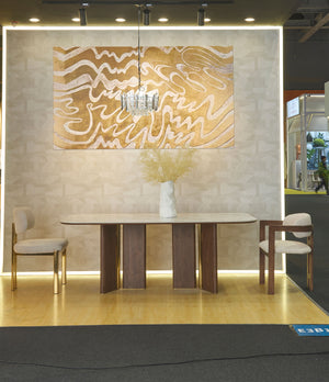 KIRA walnut and sintered stone dining table displayed with chairs in a modern furniture showroom