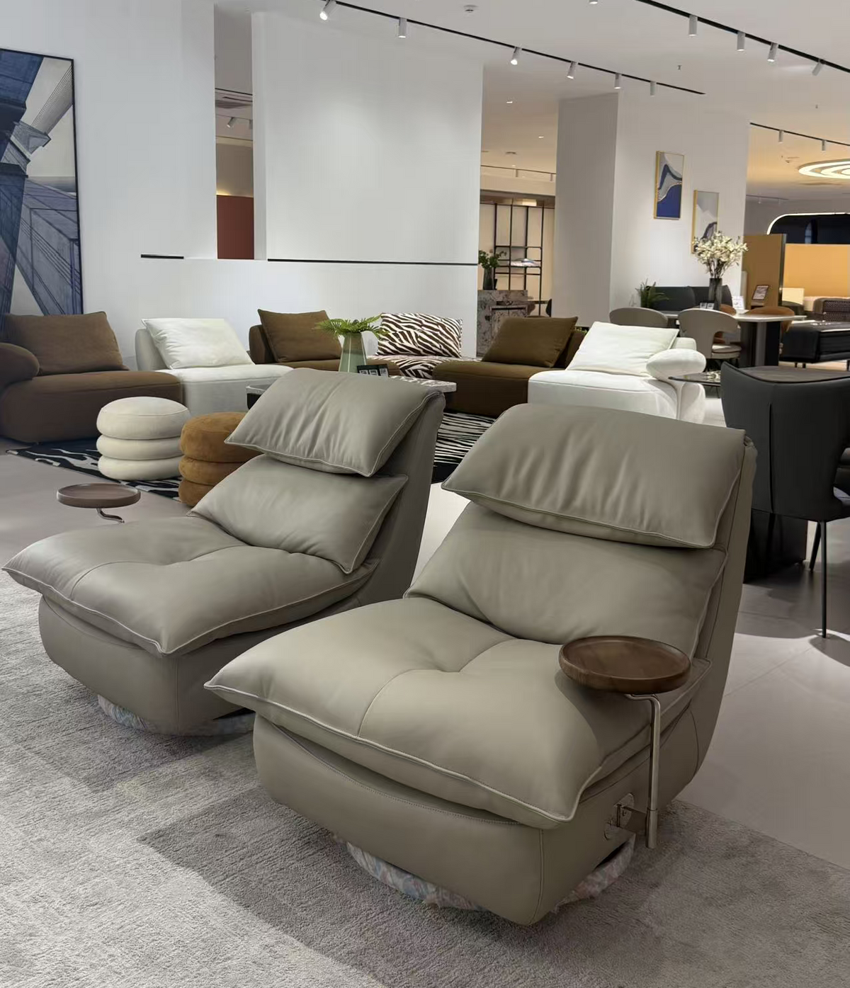 SERA oversized taupe lounge chairs with plush cushions and a relaxed low-profile design.