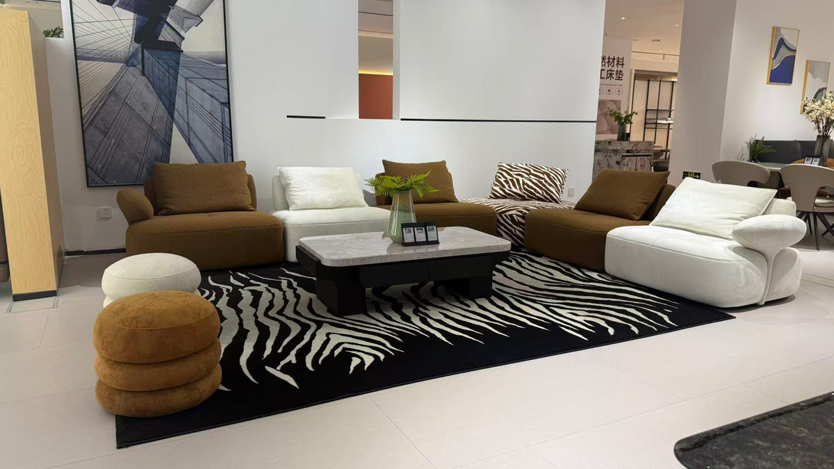 MIRA contemporary modular lounge sofa in brown, ivory and zebra-pattern upholstery.