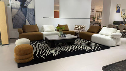 MIRA contemporary modular lounge sofa in brown, ivory and zebra-pattern upholstery.